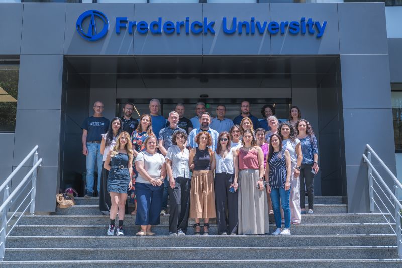 Photograph of the ACT-AI Consortium taken on the steps of Frederick University in Nicosia, Cyprus.